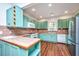Bright kitchen featuring updated appliances, custom cabinets and tile backsplash at 755 Jumbo Ln, Edisto Island, SC 29438