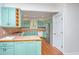 Bright kitchen with retro cabinets and stainless steel appliances at 755 Jumbo Ln, Edisto Island, SC 29438