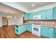 Spacious kitchen with modern appliances and custom cabinets leads into the dining area at 755 Jumbo Ln, Edisto Island, SC 29438