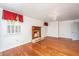 Bright living room with hardwood floors, fireplace, and abundant natural light at 755 Jumbo Ln, Edisto Island, SC 29438