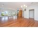 Spacious living area with hardwood floors, fireplace, and large windows overlooking outdoor views at 755 Jumbo Ln, Edisto Island, SC 29438