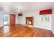 Light-filled living room with hardwood floors and decorative fireplace at 755 Jumbo Ln, Edisto Island, SC 29438