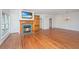 Bright living space featuring hardwood floors, fireplace with TV, and neutral walls at 755 Jumbo Ln, Edisto Island, SC 29438