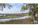 Expansive marsh view with a picturesque dock and serene waterfront scenery at 755 Jumbo Ln, Edisto Island, SC 29438