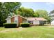 Charming single-story home featuring a manicured lawn, inviting curb appeal, and a convenient covered carport at 7605 Ireland Dr, North Charleston, SC 29420