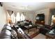 Cozy living room featuring comfortable leather furniture, a ceiling fan, and lots of natural light at 7605 Ireland Dr, North Charleston, SC 29420