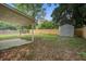 Spacious backyard featuring a covered patio, wooden fence and storage shed at 780 Corral Dr, Charleston, SC 29414