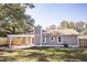 Exterior rear view featuring a large backyard with patio and tall trees at 780 Corral Dr, Charleston, SC 29414