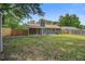 Backyard featuring a wood fence, a chimney and a grassy area at 780 Corral Dr, Charleston, SC 29414