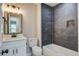 A modern bathroom features a tub-shower with sleek dark tiling and a white vanity at 780 Corral Dr, Charleston, SC 29414
