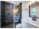 Modern bathroom featuring a glass shower with dark tile and a white vanity at 780 Corral Dr, Charleston, SC 29414