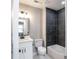 Bathroom featuring modern black tiles, a tub, and a white vanity with sleek fixtures at 780 Corral Dr, Charleston, SC 29414