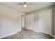 Bedroom with ceiling fan, plank floors and double closets at 780 Corral Dr, Charleston, SC 29414