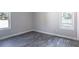 Bright bedroom with hardwood floors and lots of natural light from the double-paned windows at 780 Corral Dr, Charleston, SC 29414