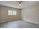 A bright bedroom featuring hard surface floors, a window and a ceiling fan at 780 Corral Dr, Charleston, SC 29414