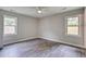 A bedroom has plank floors, a ceiling fan and windows for natural light at 780 Corral Dr, Charleston, SC 29414