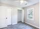 Cozy bedroom with ceiling fan, closet with bi-fold doors, and window for natural light at 780 Corral Dr, Charleston, SC 29414