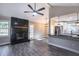 Open living space with modern fireplace and contemporary lighting adjoining the kitchen at 780 Corral Dr, Charleston, SC 29414