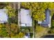 Captivating bird's-eye view of a home with a manicured yard, patio, and mature trees offering outdoor enjoyment at 825 Marsh Grove Ave, Mount Pleasant, SC 29464