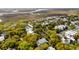 Picturesque aerial view of a charming residential area with marsh views and mature trees at 825 Marsh Grove Ave, Mount Pleasant, SC 29464