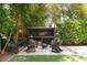 Inviting backyard fire pit with Adirondack chairs and custom wood rack featuring a unique American flag design at 825 Marsh Grove Ave, Mount Pleasant, SC 29464