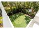 Aerial view of backyard with putting green and lush landscaping at 825 Marsh Grove Ave, Mount Pleasant, SC 29464