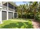 Backyard with putting green, lush landscaping, and a screened porch at 825 Marsh Grove Ave, Mount Pleasant, SC 29464