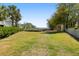 Spacious backyard featuring lush green lawn and mature trees, perfect for outdoor activities at 825 Marsh Grove Ave, Mount Pleasant, SC 29464