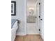 Bathroom view from bedroom featuring bright, neutral finishes and lots of natural light at 825 Marsh Grove Ave, Mount Pleasant, SC 29464