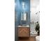 Stylish bathroom with blue shiplap walls, vessel sink, and a glass-enclosed shower with subway tile at 825 Marsh Grove Ave, Mount Pleasant, SC 29464