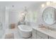 Bright bathroom featuring a freestanding tub, double sinks, and modern finishes at 825 Marsh Grove Ave, Mount Pleasant, SC 29464