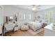 Charming bedroom featuring hardwood floors, a comfortable bed, and a bright window at 825 Marsh Grove Ave, Mount Pleasant, SC 29464