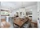 Open-concept kitchen and dining area with modern lighting, wood floors, and a spacious layout at 825 Marsh Grove Ave, Mount Pleasant, SC 29464