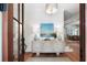 Inviting entryway with wood floors, shiplap walls, stylish console table, and ample natural light at 825 Marsh Grove Ave, Mount Pleasant, SC 29464