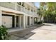Spacious ground floor exterior with multiple garage bays and convenient under-house parking at 825 Marsh Grove Ave, Mount Pleasant, SC 29464
