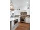 Chef's kitchen with top-of-the-line Wolf oven, custom cabinetry, and a center island with seating at 825 Marsh Grove Ave, Mount Pleasant, SC 29464