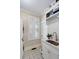 Well-organized laundry room with custom cabinets, patterned tile floors, and plenty of natural light at 825 Marsh Grove Ave, Mount Pleasant, SC 29464
