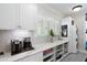 Laundry room features marble countertops, white cabinets, and built-in shelving at 825 Marsh Grove Ave, Mount Pleasant, SC 29464