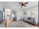 Bright sitting room featuring a comfortable couch, desk area, and lots of natural light at 825 Marsh Grove Ave, Mount Pleasant, SC 29464