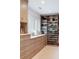 Custom walk-in closet with built-in shelving, drawers, and counter space, perfect for organizing clothes and accessories at 825 Marsh Grove Ave, Mount Pleasant, SC 29464
