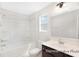Bathroom featuring framed mirror, tiled tub/shower combo at 1008 Drakeford St # 4P, Saint George, SC 29477