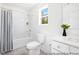 Clean bathroom with a shower-tub combination, white vanity, and a window allowing natural light at 1008 Drakeford St # 4P, Saint George, SC 29477