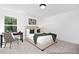 Bright bedroom featuring a comfortable bed, a desk next to the window, and neutral decor at 1008 Drakeford St # 4P, Saint George, SC 29477