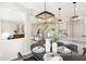 Dining area showcasing stylish pendant lighting, modern decor, and easy access to the gourmet kitchen at 1008 Drakeford St # 4P, Saint George, SC 29477