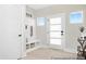 Bright entryway with a storage bench, coat hooks, and plenty of natural light from the windows at 1008 Drakeford St # 4P, Saint George, SC 29477