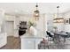 Bright kitchen featuring an island with bar seating, stainless appliances, and modern pendant lighting at 1008 Drakeford St # 4P, Saint George, SC 29477