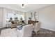 Bright living room with neutral decor, stylish furnishings, and views of the surrounding neighborhood at 1008 Drakeford St # 4P, Saint George, SC 29477