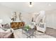 Stylish living room featuring contemporary decor, neutral tones, and a staircase leading to the upper level at 1008 Drakeford St # 4P, Saint George, SC 29477
