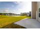 Lush backyard featuring green grass and a pond view, perfect for outdoor relaxation at 1017 Marsh Harrier Dr # Cc3-3-3, Ravenel, SC 29470