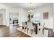 Inviting dining area with natural light, a wooden table, and seating for six, creating a perfect gathering space at 1017 Marsh Harrier Dr # Cc3-3-3, Ravenel, SC 29470